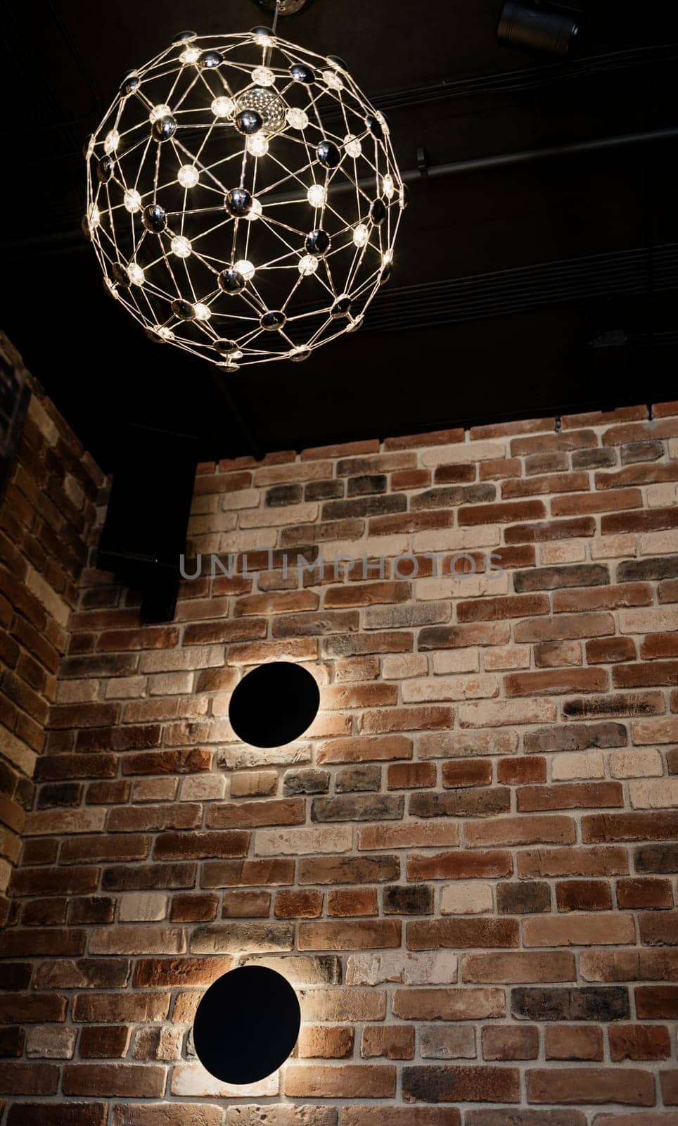 luminous stylish pendant lamp in the loft interior