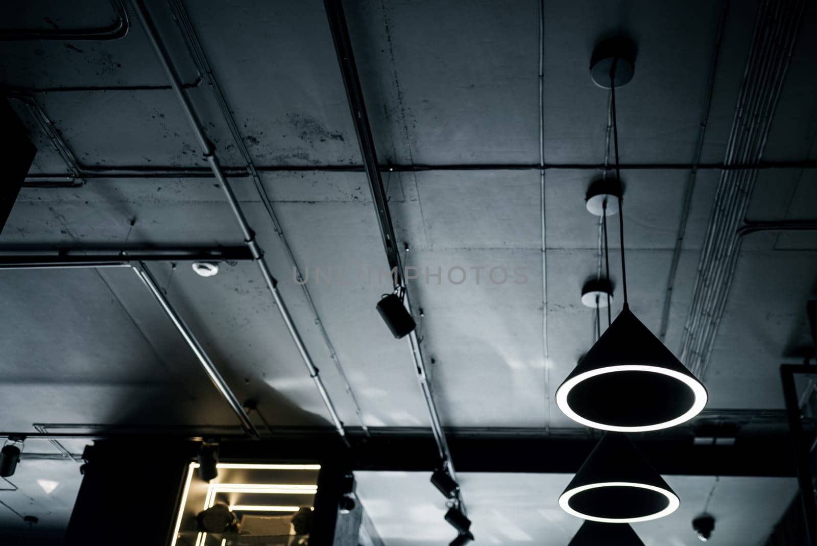 hanging lamps in the loft style . Cold light