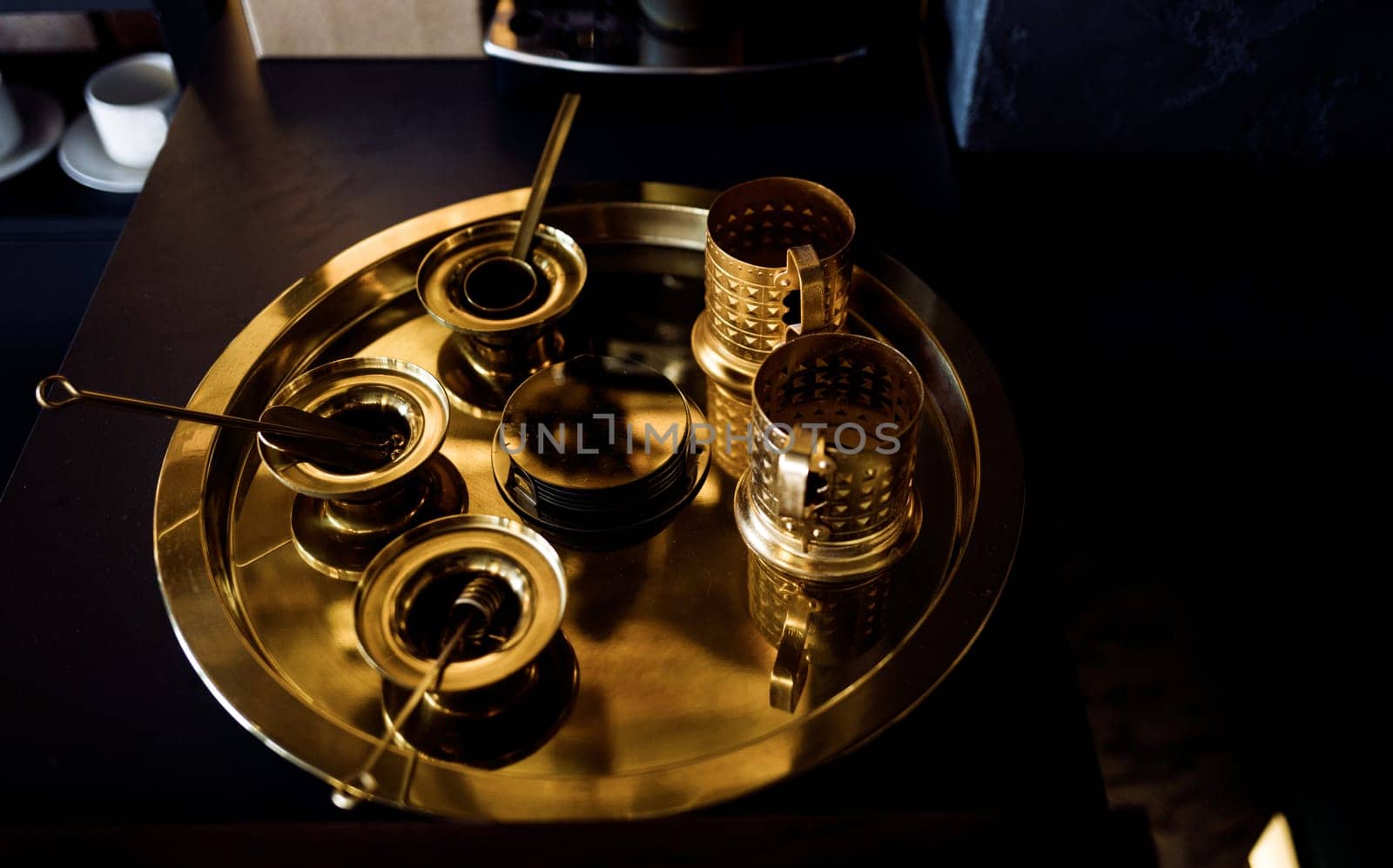 vintage gold mugs on a tray. metal tableware