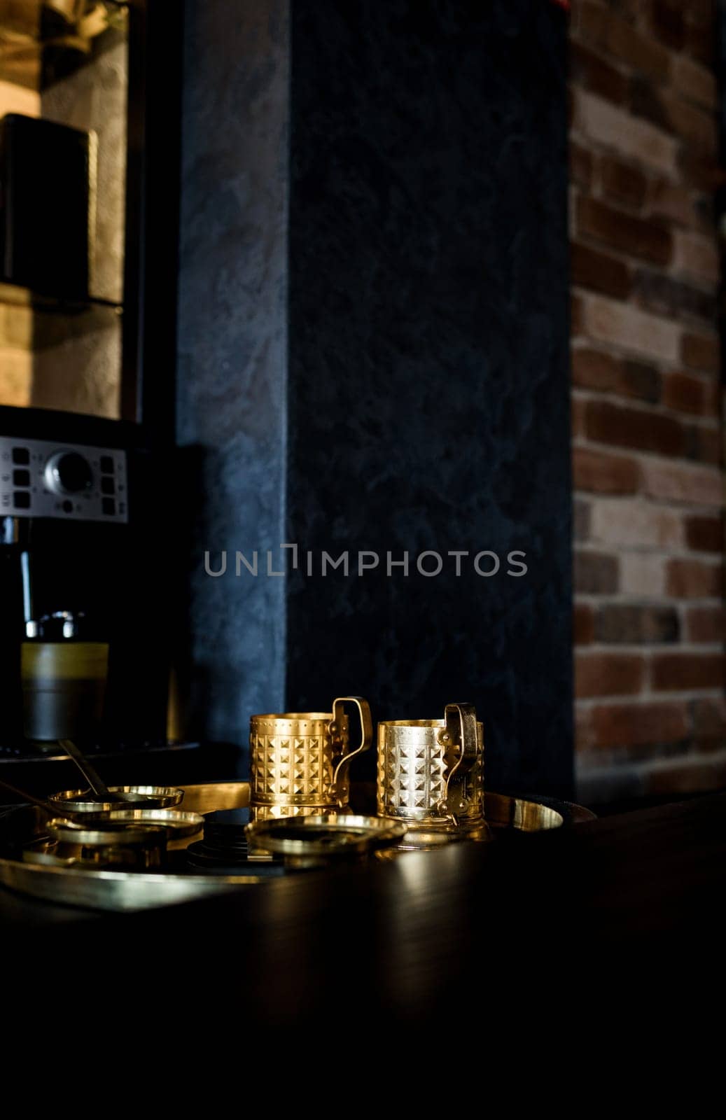 golden retro coffee cups in loft interior. vintage cafe