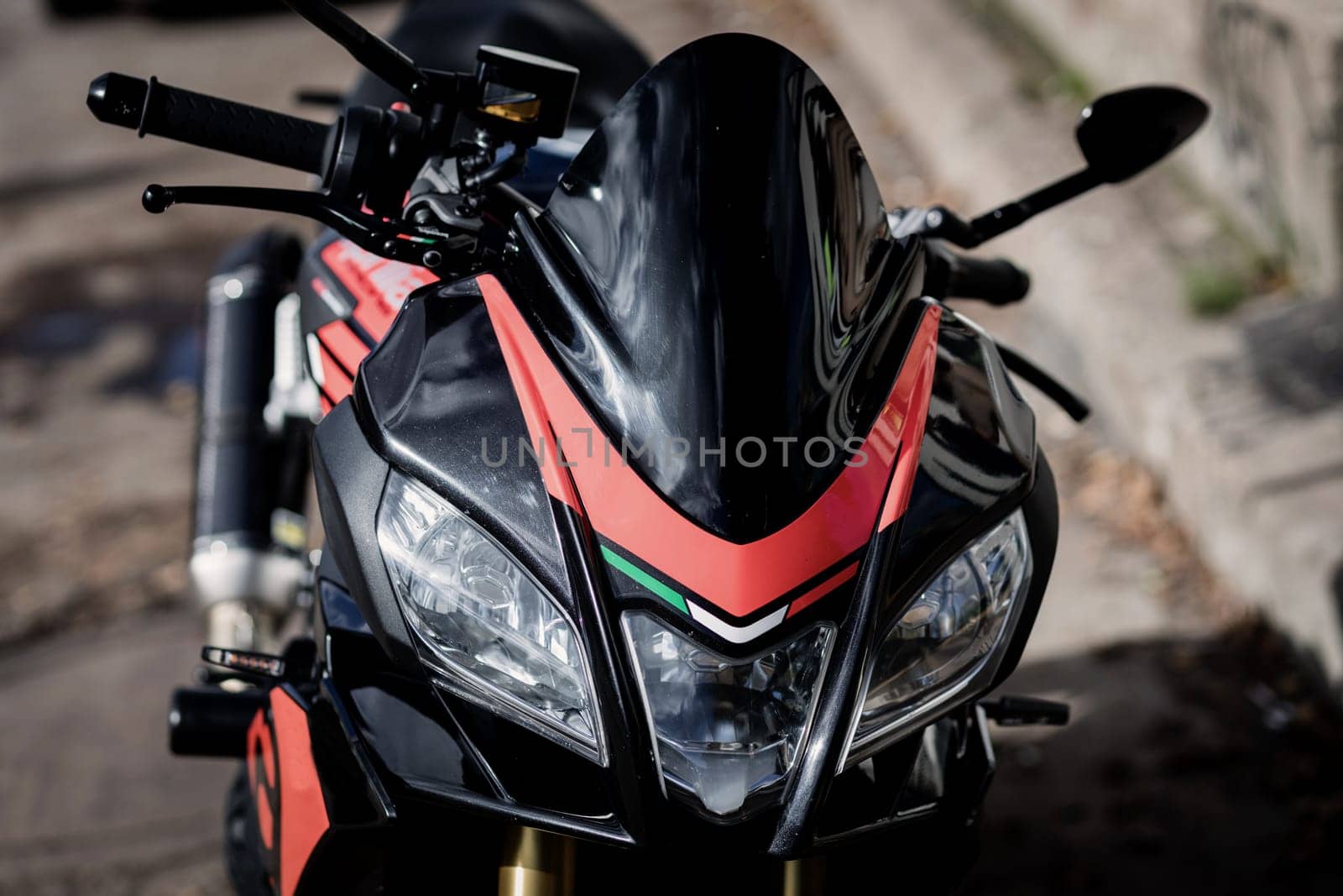 Headlight of the black sports motorcycle.