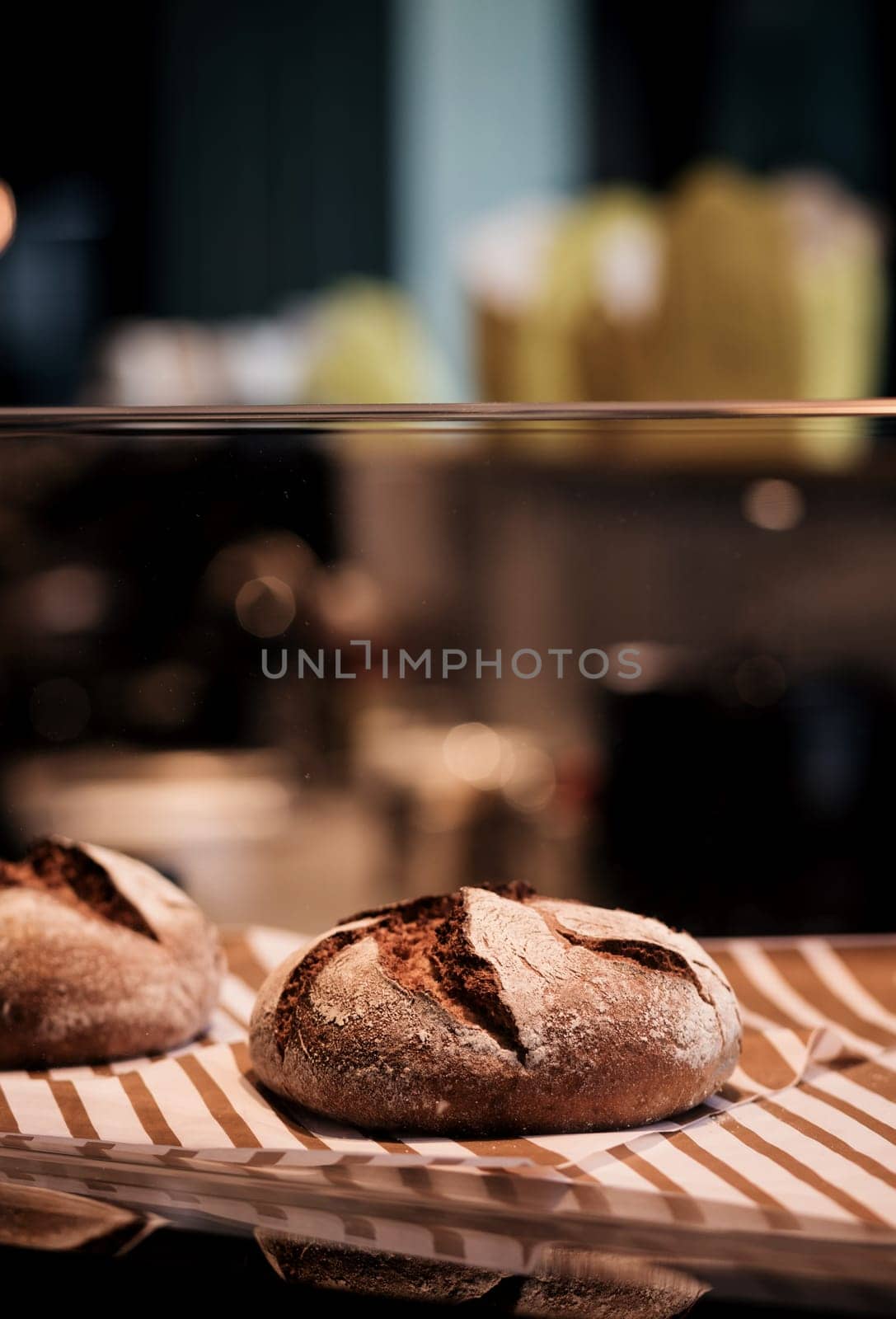 Tasty-looking artisan bread above kitchen counter. Artisan baked goods