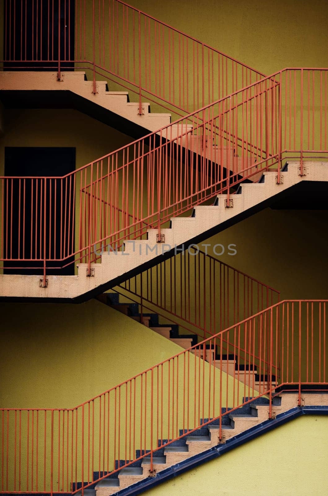 stairs for fire escape of the factory building.The factory wall building and the yellow stair building