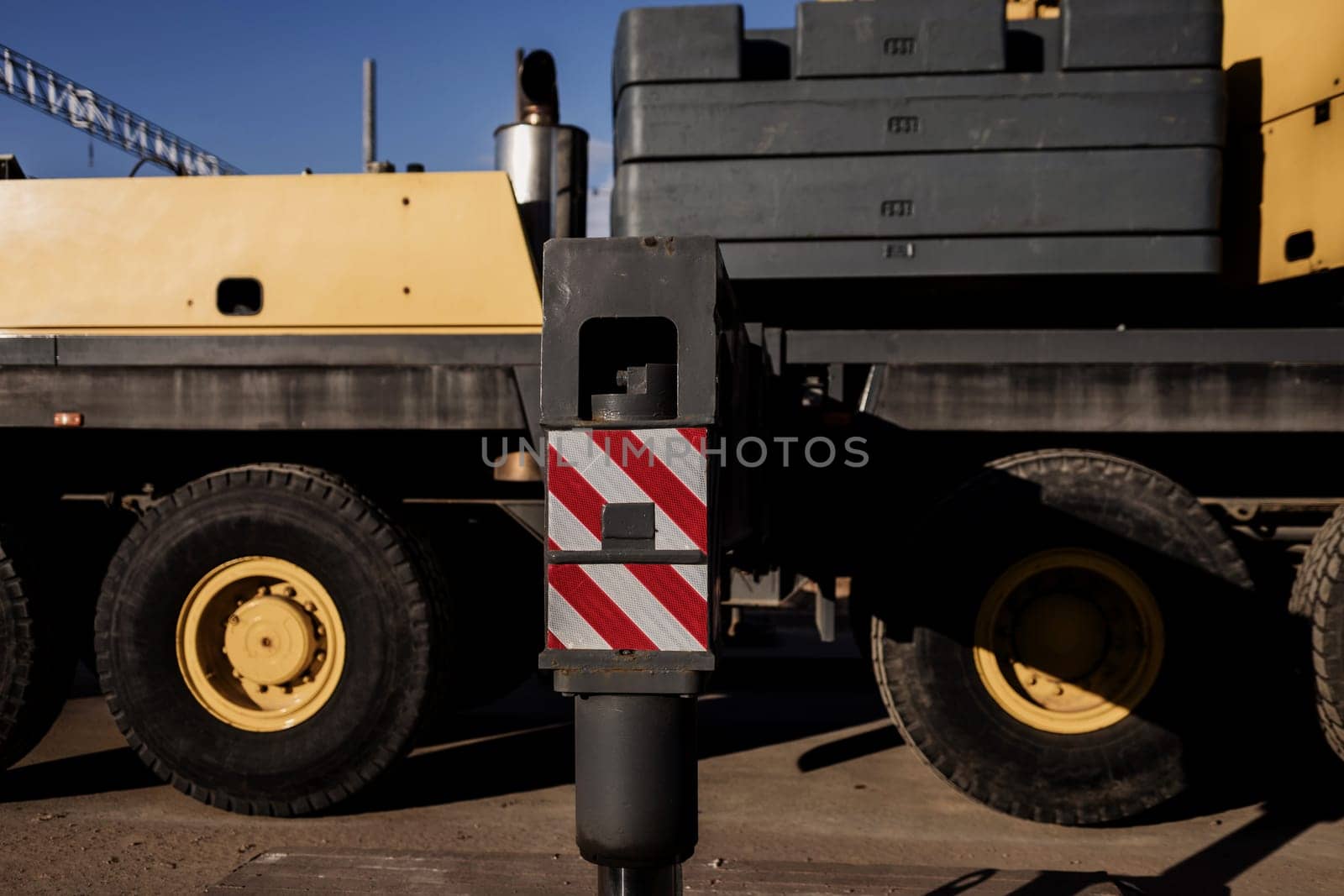 Mobile yellow crane truck on construction site
