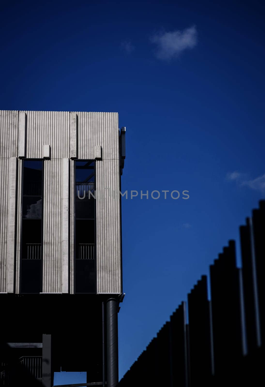 new concrete building. modern commercial architecture over sky background