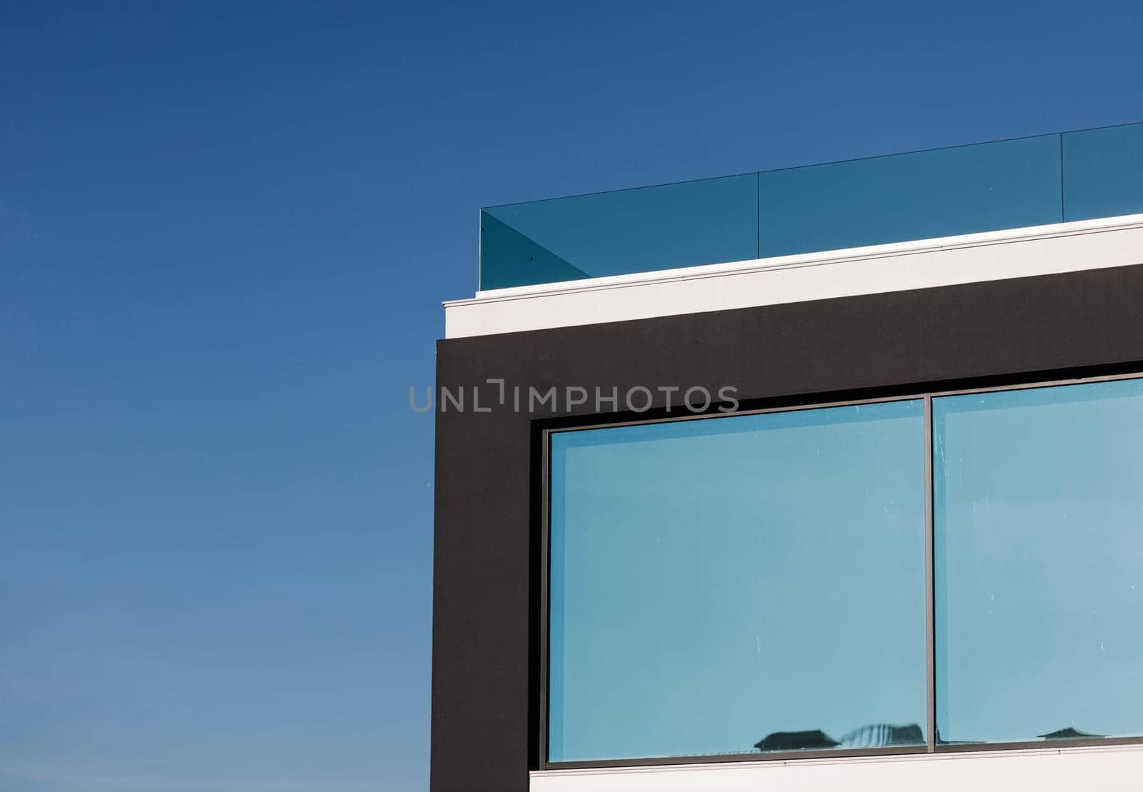 element in front of a modern house over sky background. commercial real estate