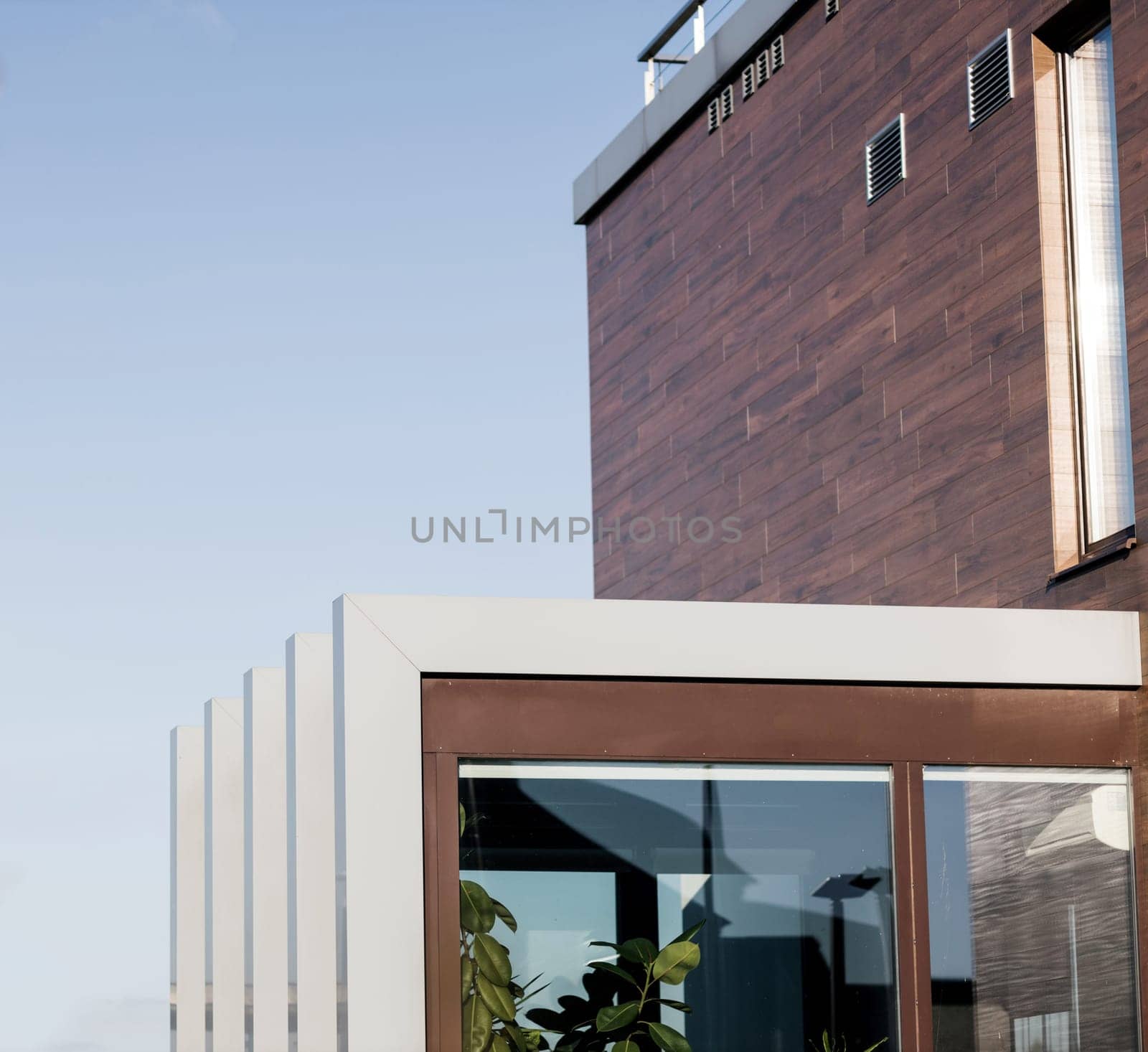Modern house with large windows. Actual eco architecture