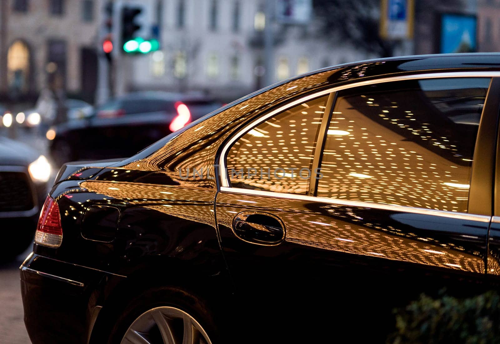 Black car standing city at night. Car in darkness