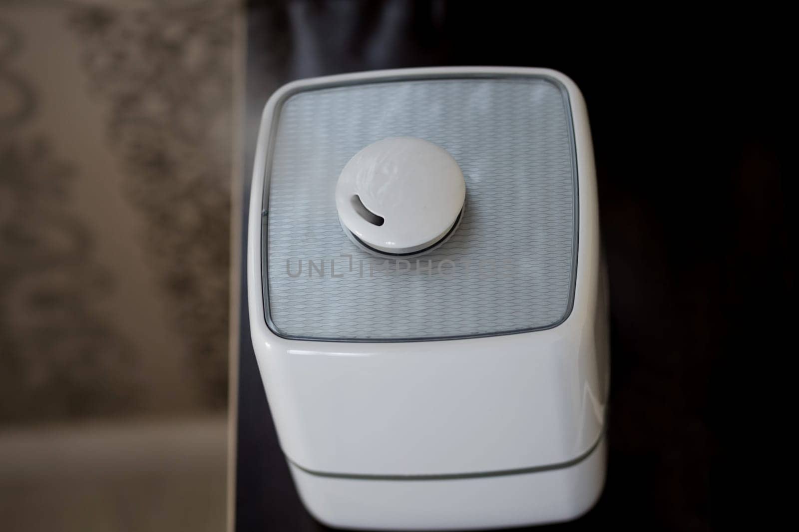 Modern air humidifier at home. Improving the comfort of living in a house, Improving the well-being. 