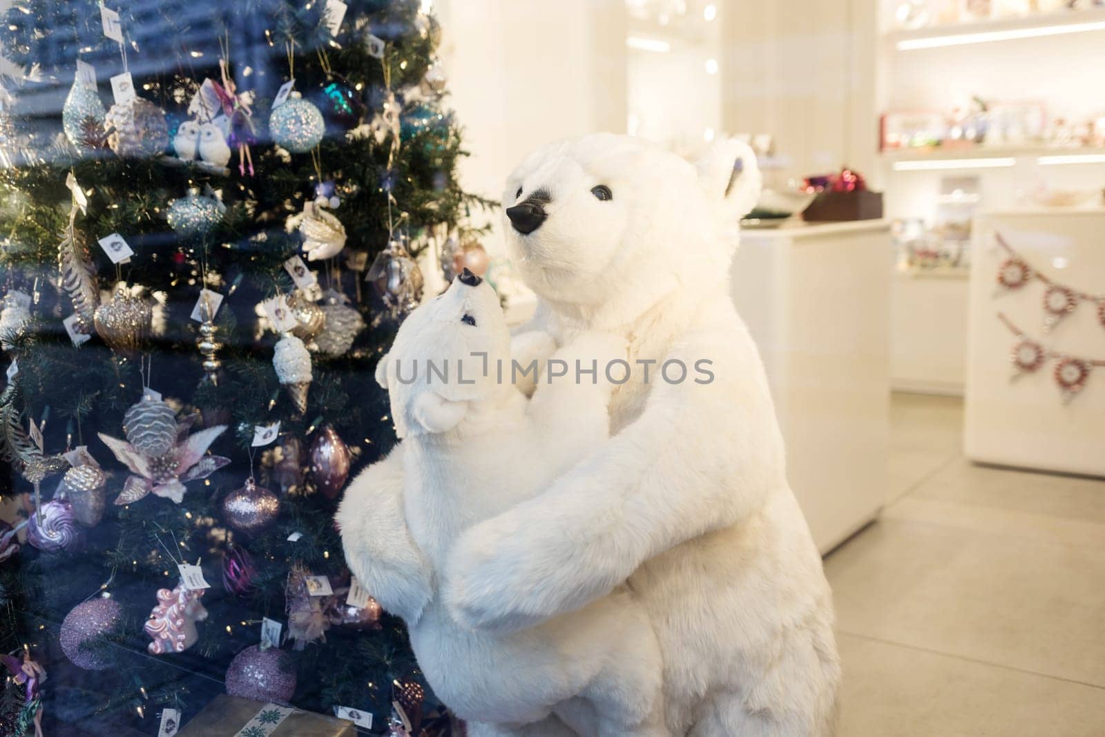 White polar bear near christmas tree