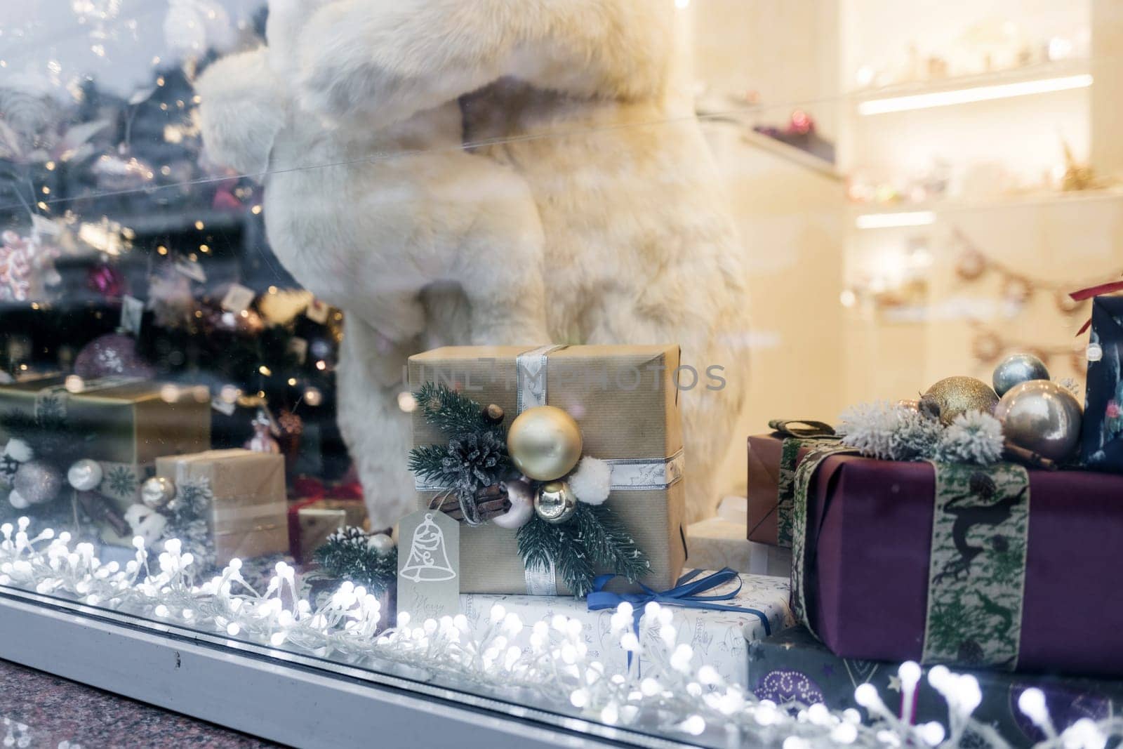decorated shop window for Christmas. holiday decor and gift boxes
