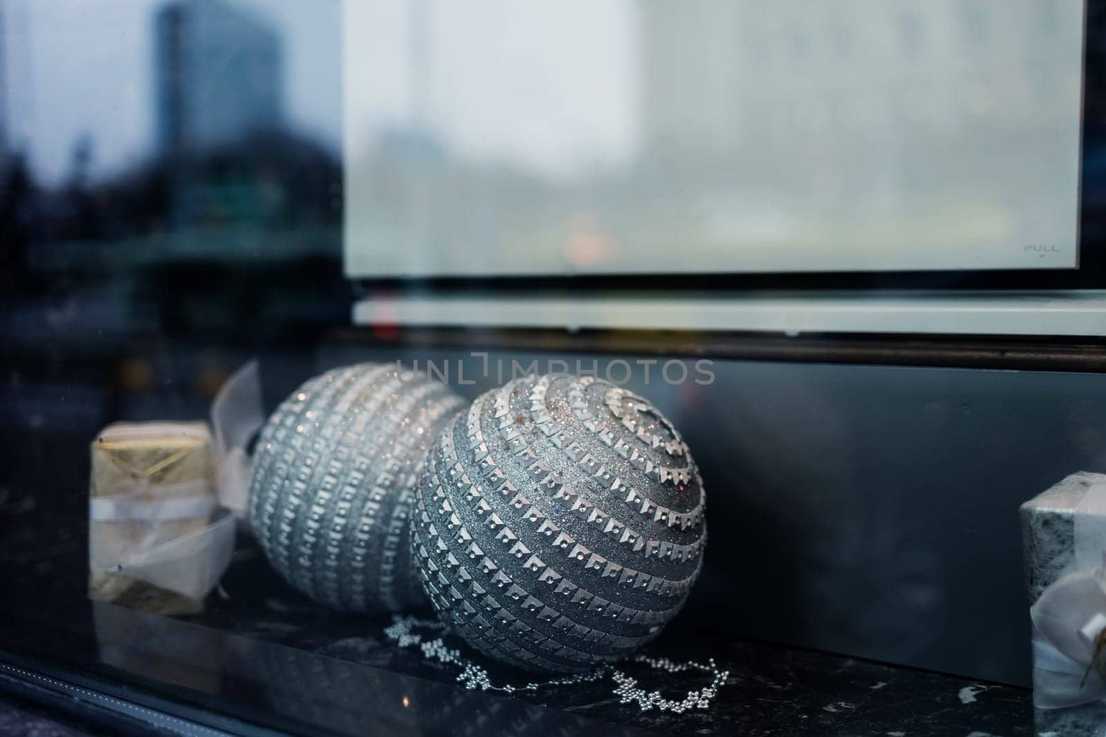 christmas glass balls on shop vitrine. new year's decor