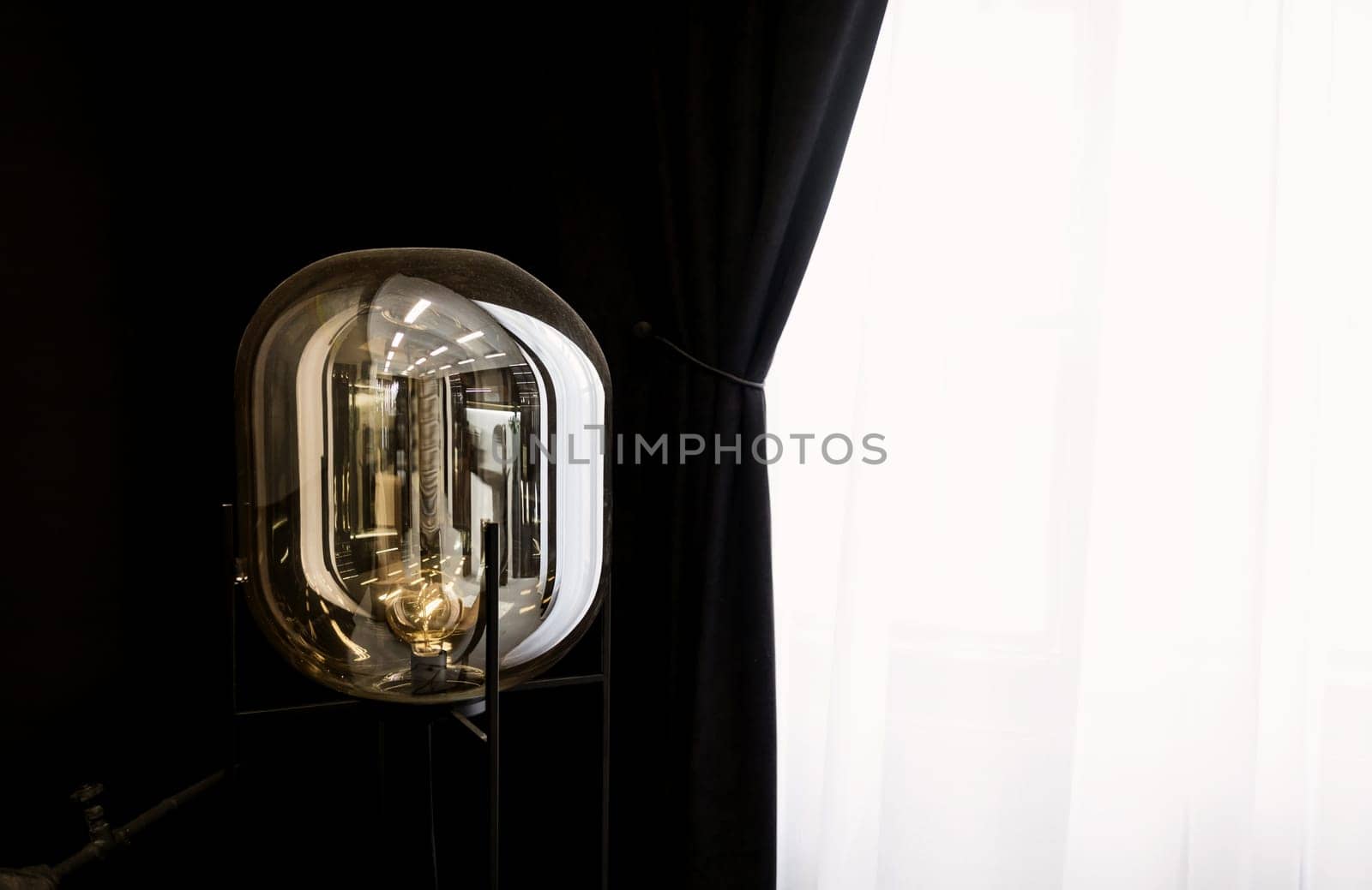 Modern glass lamp in apartment. Minimalistic design