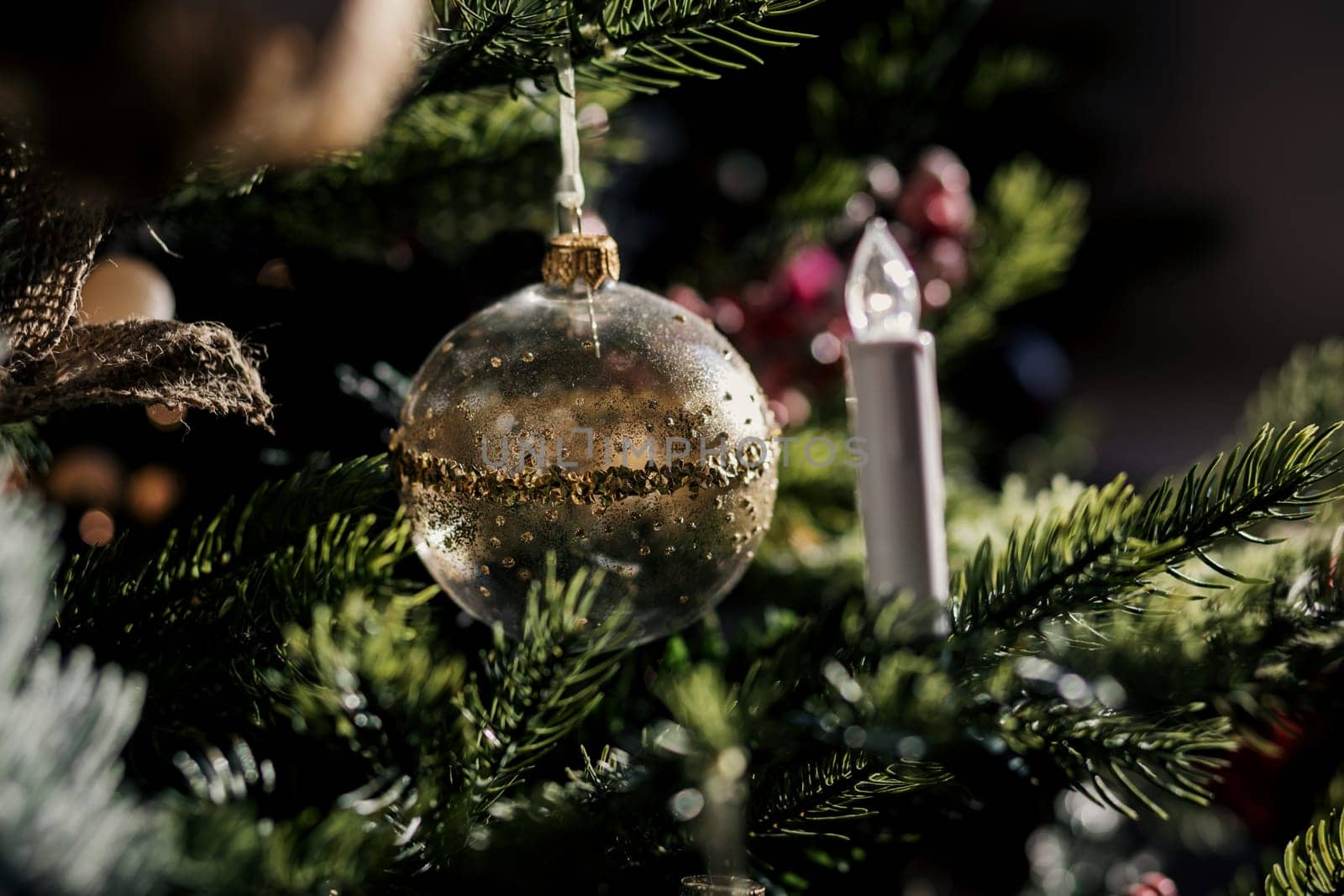 Christmas celebration holiday background - christmas-tree decoration bauble on decorated Christmas tree