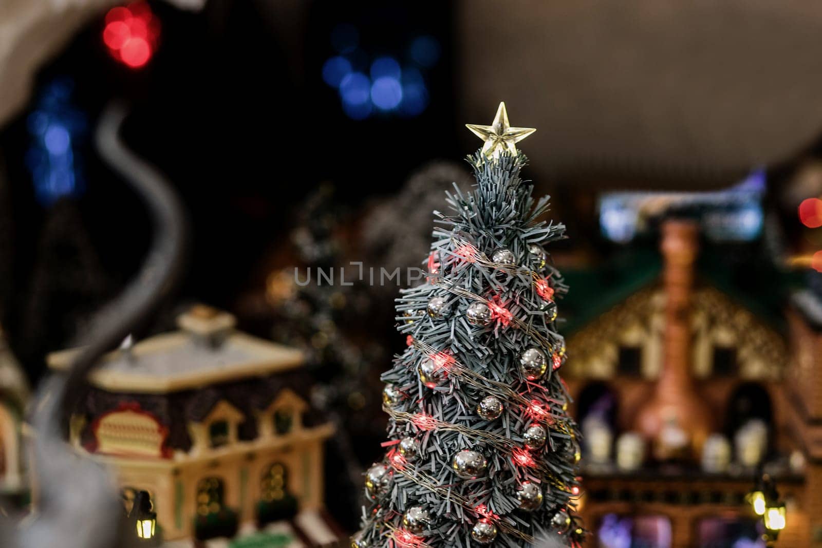 christmas tree in miniature. Christmas toys. mini city