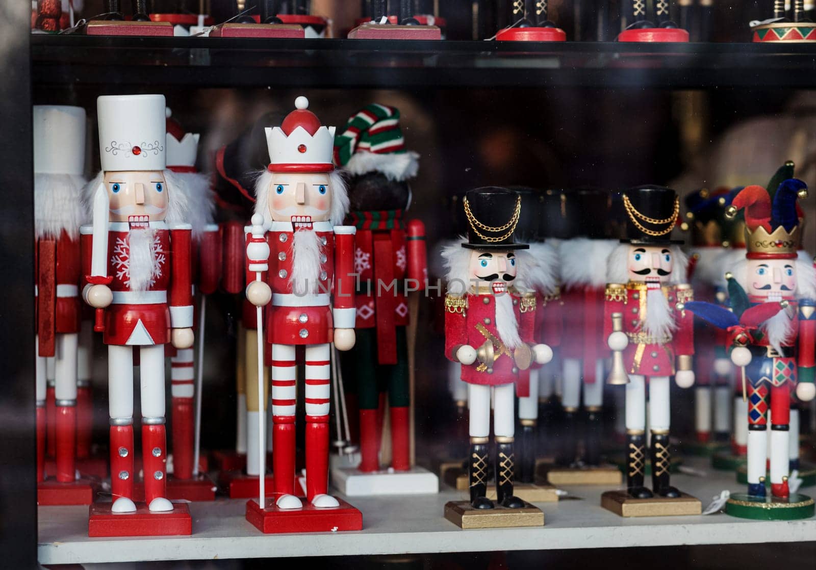 Christmas wooden Nutcracker on the shop window.  Festive soldier 