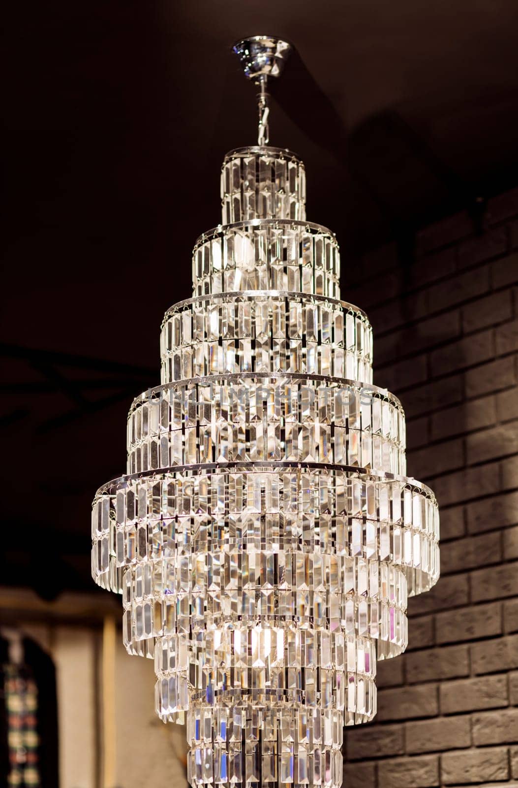 Big modern chandelier. Luxury crystal lamp