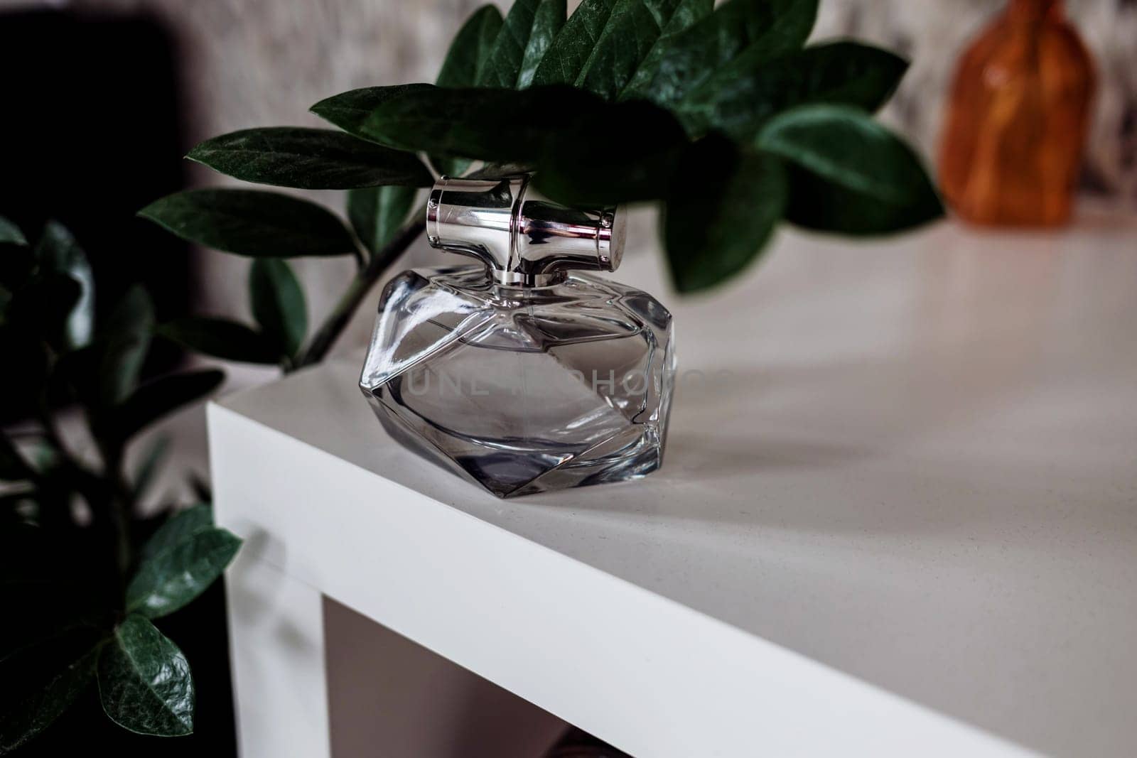 bottle of woman perfume, flat lay. Fragrance perfume bottle on table