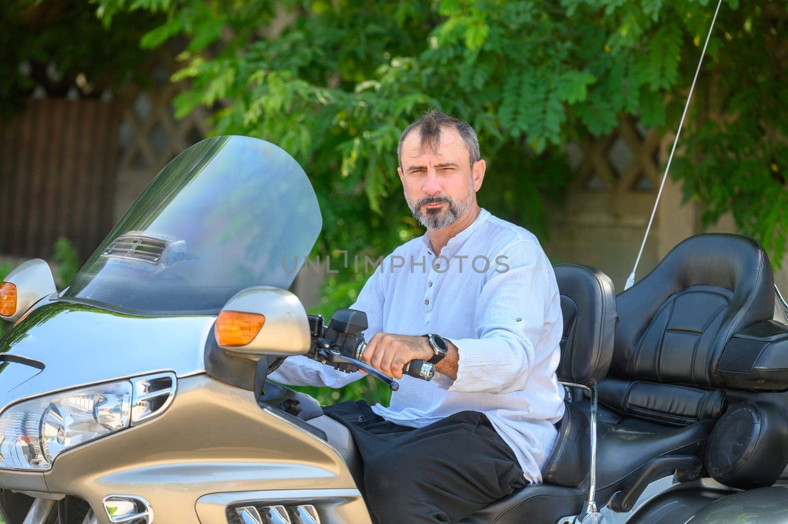 man sitting on a motorcycle 2