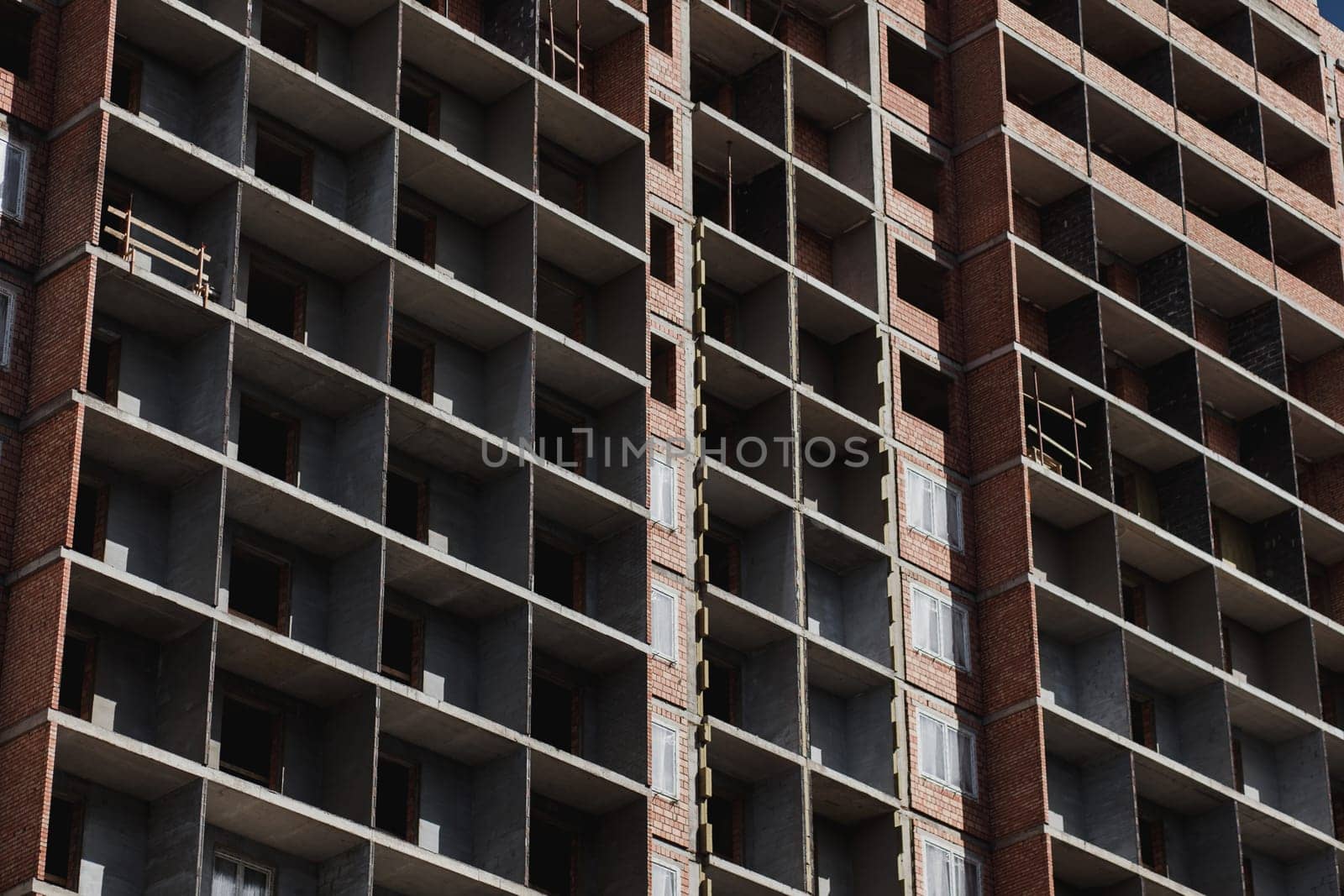 Unfinished cement building on a construction site.