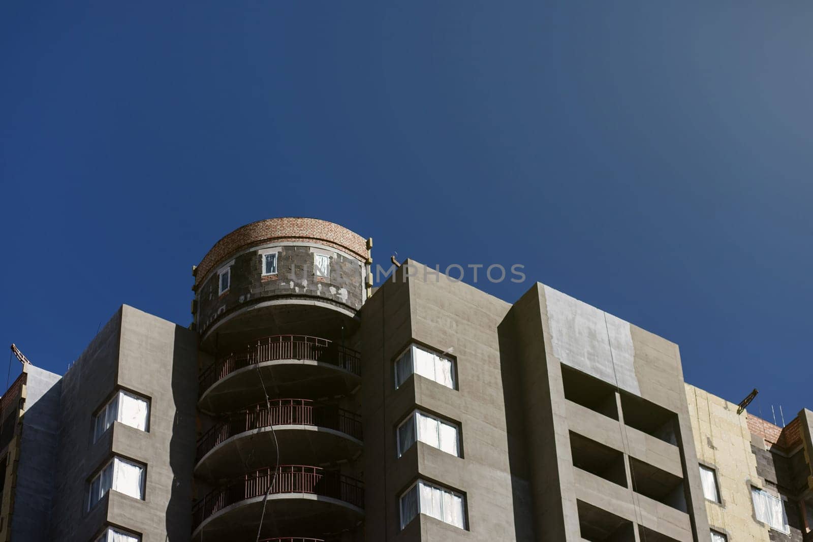 residential building under construction and on a background of blue sky. mortgage