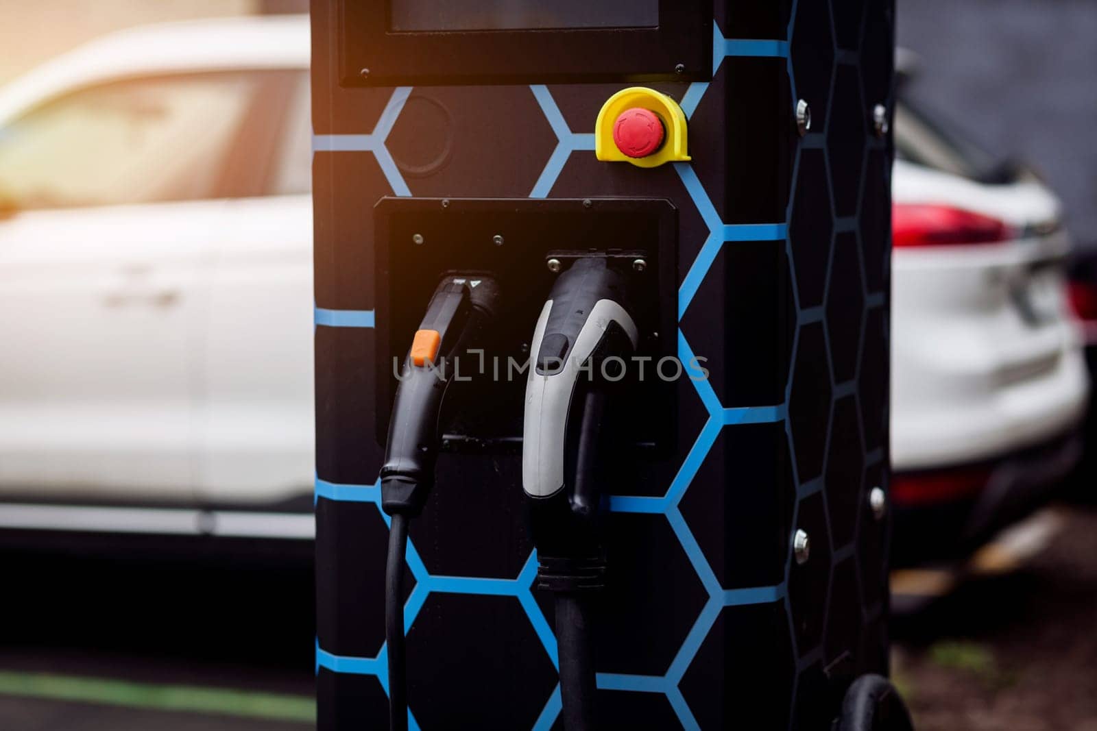 electric vehicle charging station with plug of power. Flare light effect.