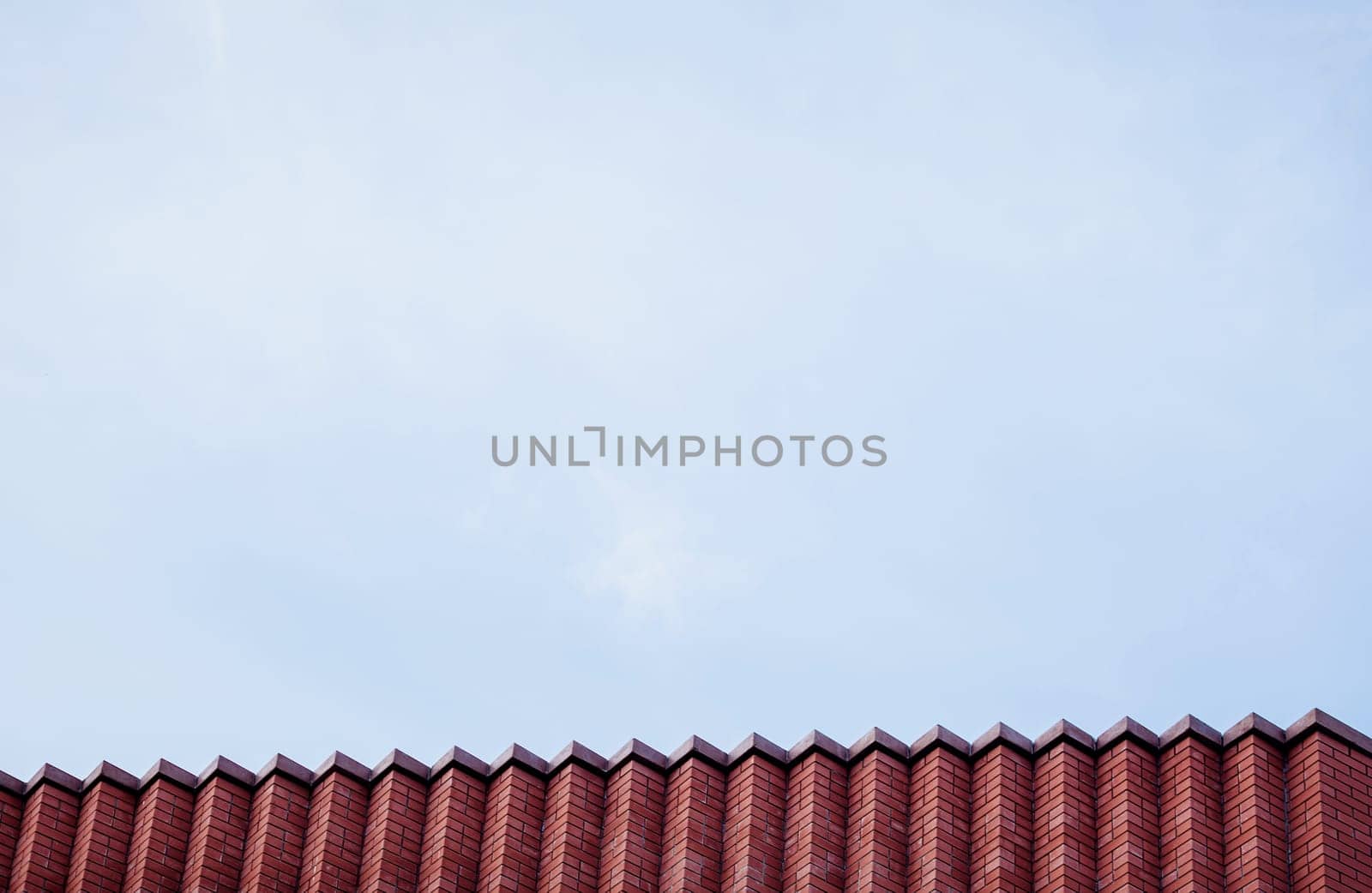 red brick office building over sky background. space for text