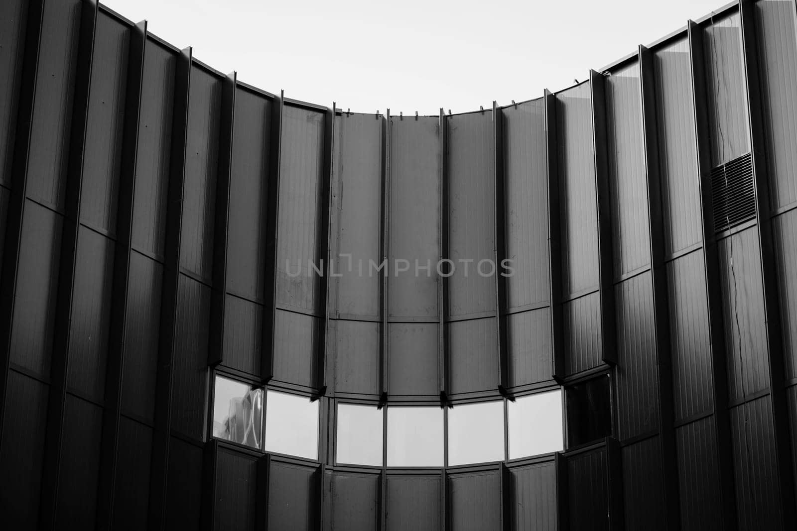 Abstract architecture, fragment of modern urban geometry. Walls made of steel and glass.