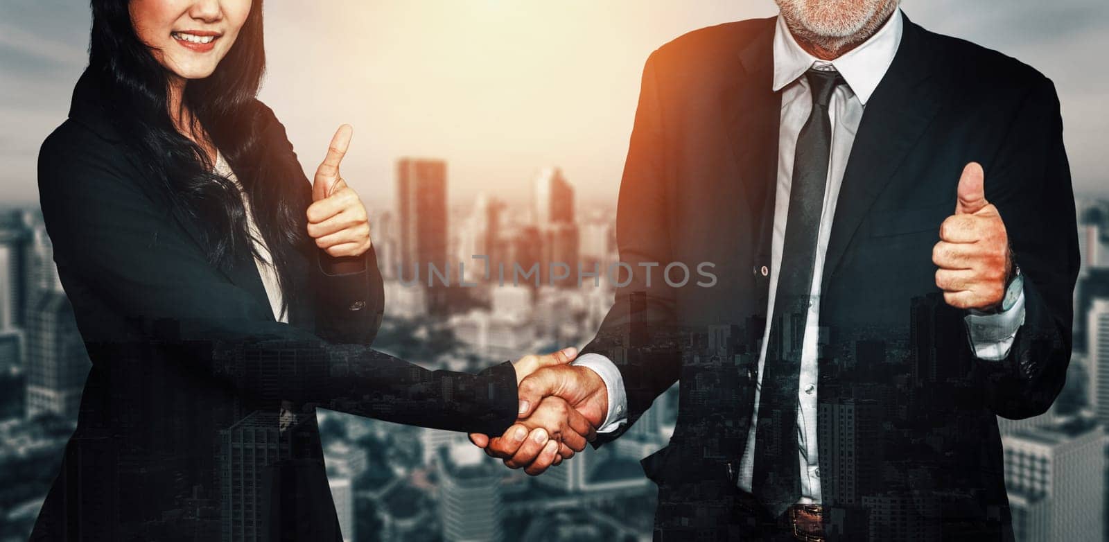 Double exposure image of business people handshake on city office building in background show partnership success of business deal. Concept of corporate teamwork, trust partner and work agreement. uds