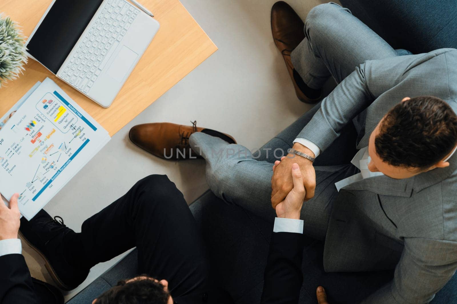 Businessmen handshake business deal in office. uds by biancoblue