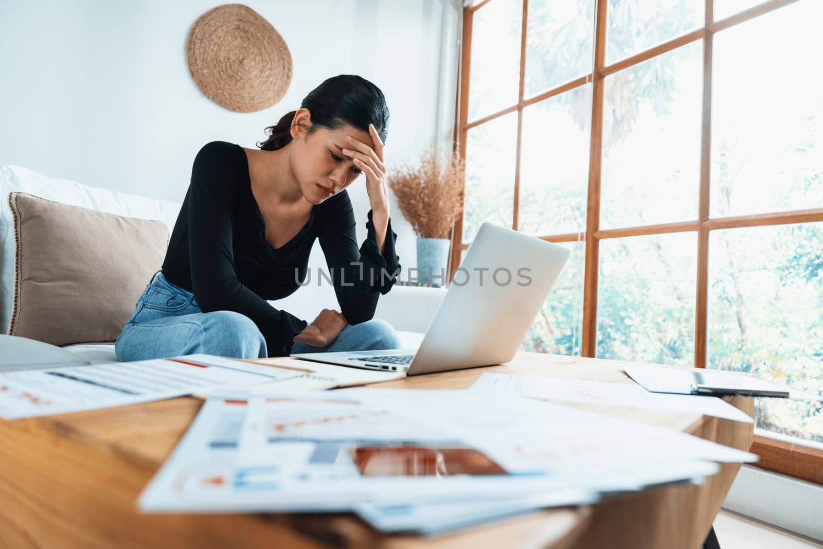 Stressed young woman has financial problems with credit card debt to pay uttermost show concept of bad personal money and mortgage pay management crisis.