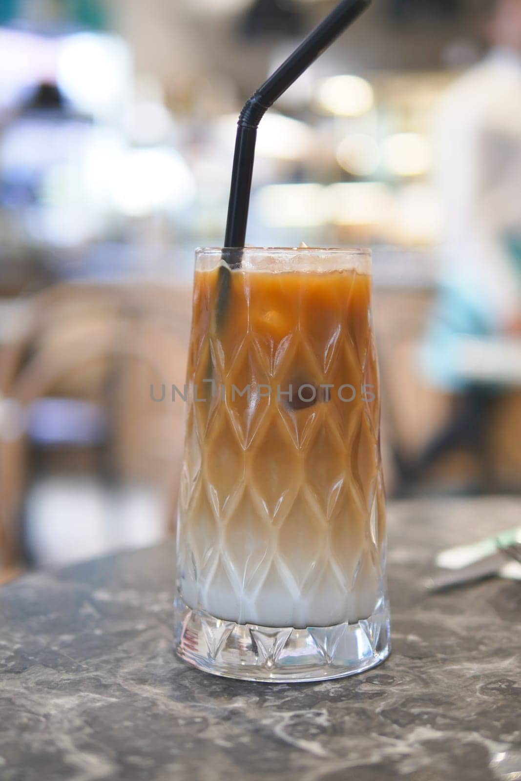 iced late in a transparent glass on cafe table by towfiq007