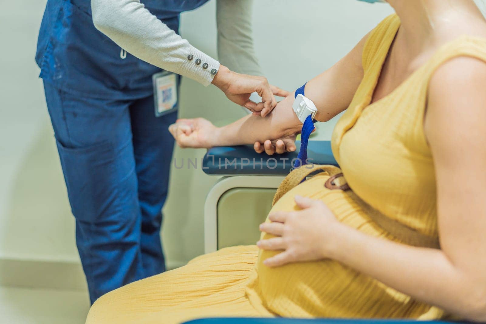 pregnant woman undergoes a blood test, a pivotal step in ensuring the well-being of both herself and her developing baby during the maternity journey by galitskaya