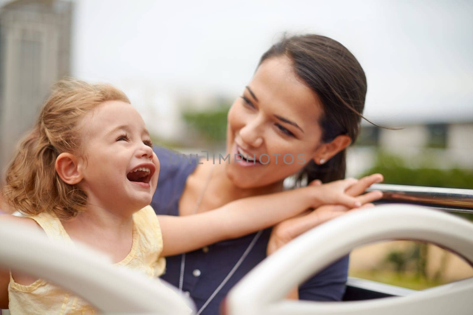 Smile, mother and child travel on bus together on vacation, holiday and family trip outdoor. Happy girl, kid and mom on journey, funny and laughing tourist excited for sightseeing on transportation.