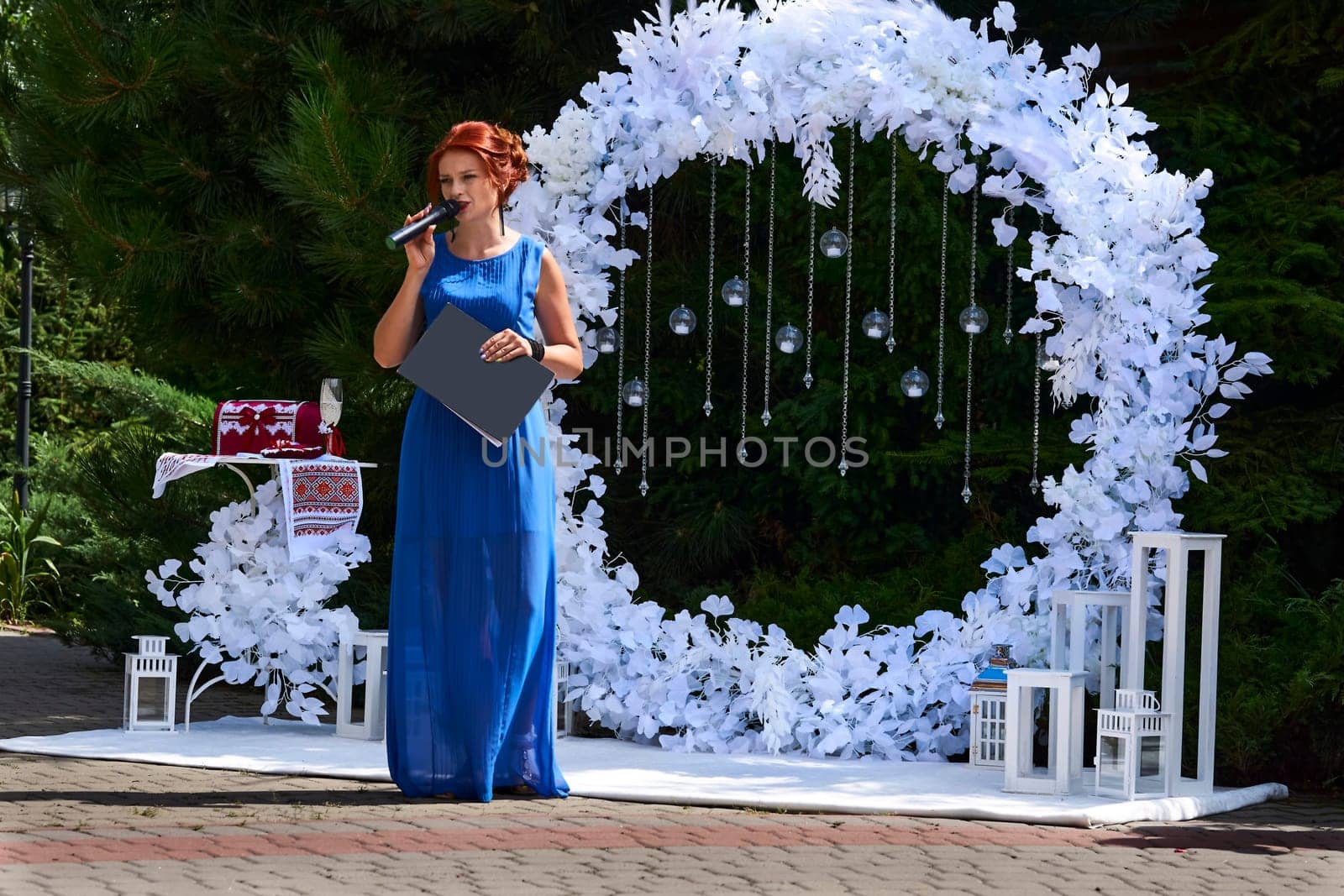 Host of a wedding ceremony, festive event with a microphone by jovani68