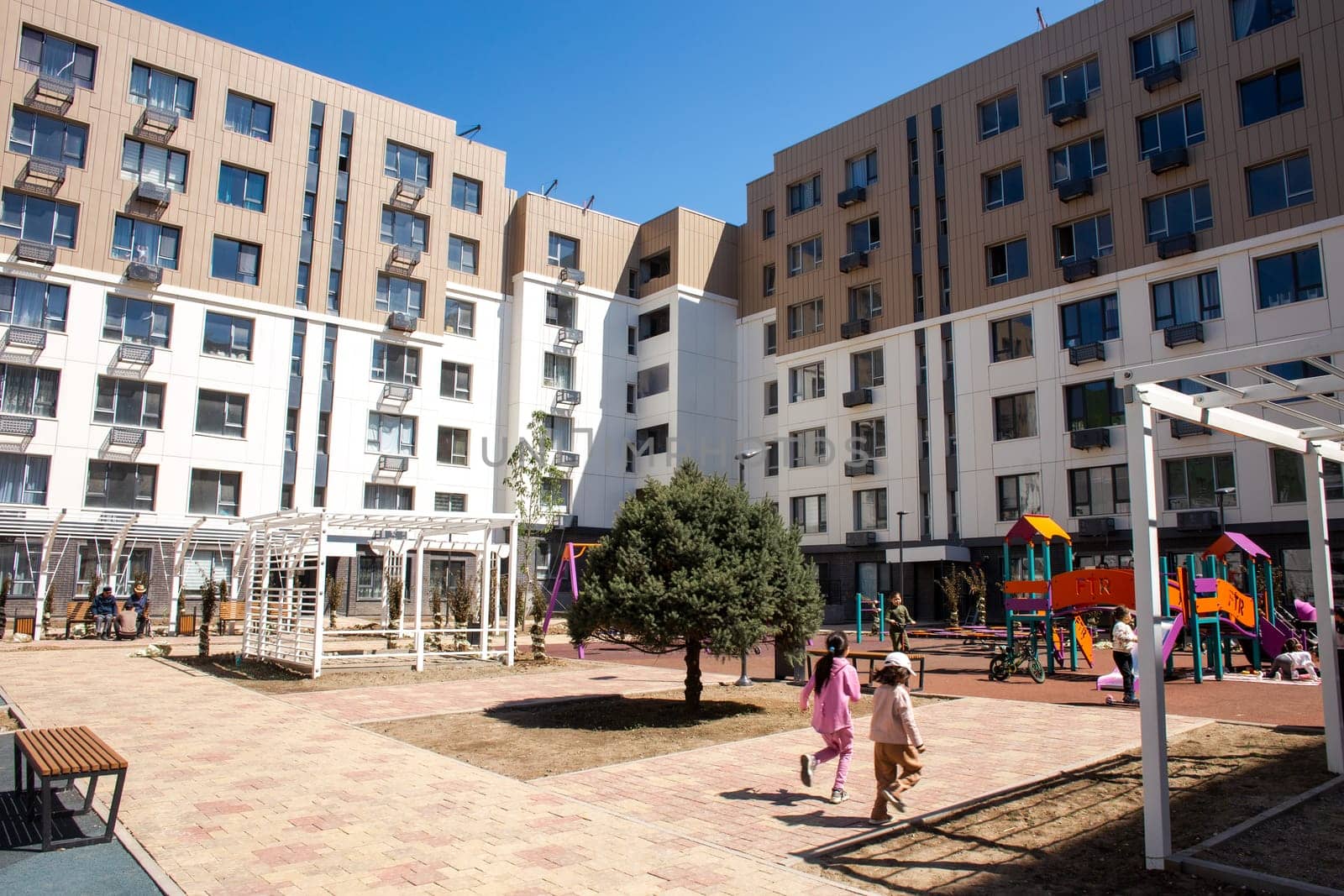 A vibrant playground with colorful equipment for kids, creating a fun and safe environment for families to enjoy together.