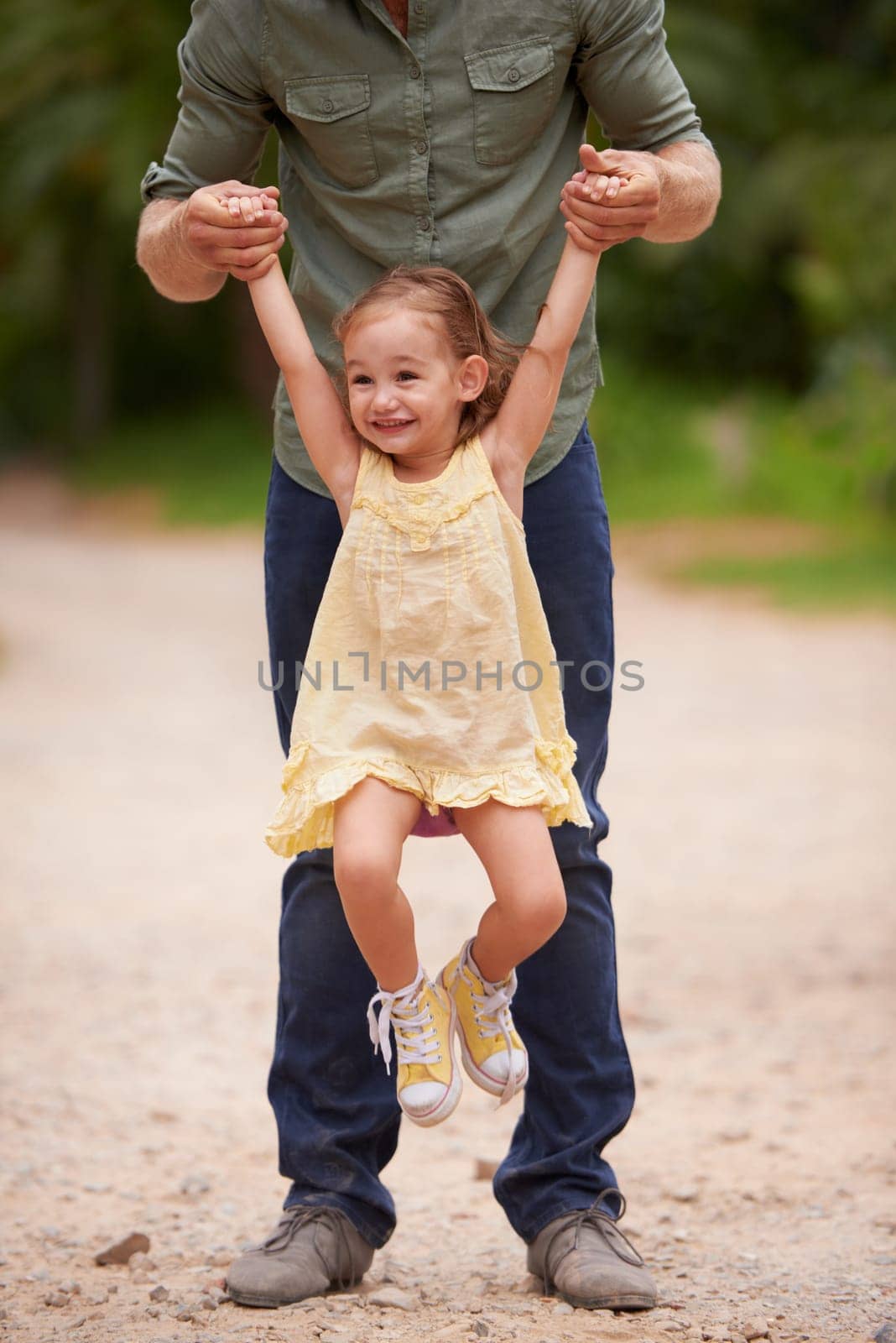 Father, child and lifting outdoor for game together in nature on holiday vacation for love connection, playing or adventure. Male person, daughter and happiness in Australia or bonding, fun or travel.
