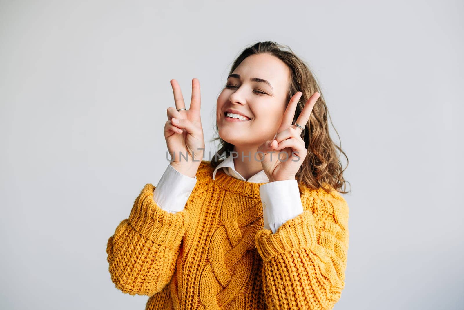 Young Woman Model Poses with Joyful Gestures - Cheerful, Playful, and Pretty - Smiling and Laughing with Victory and Peace Signs - Positive and Cute Expression - Joyful Isolation on White Background