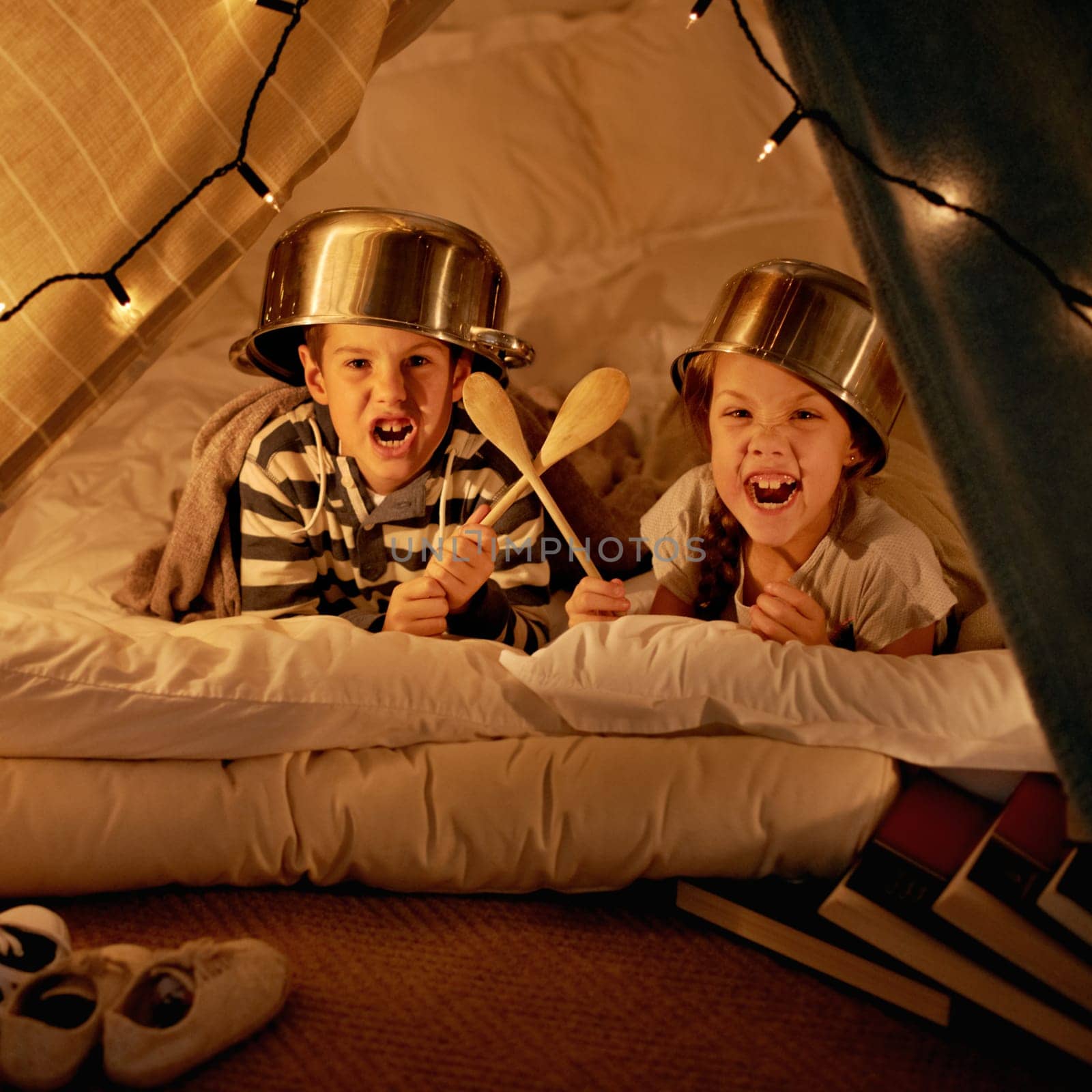 Children, siblings and portrait with pot, helmet or spoon in a fort for fantasy, learning or playing at home. Happy family, face or kids on a floor with tent games, development or bonding in a house by YuriArcurs