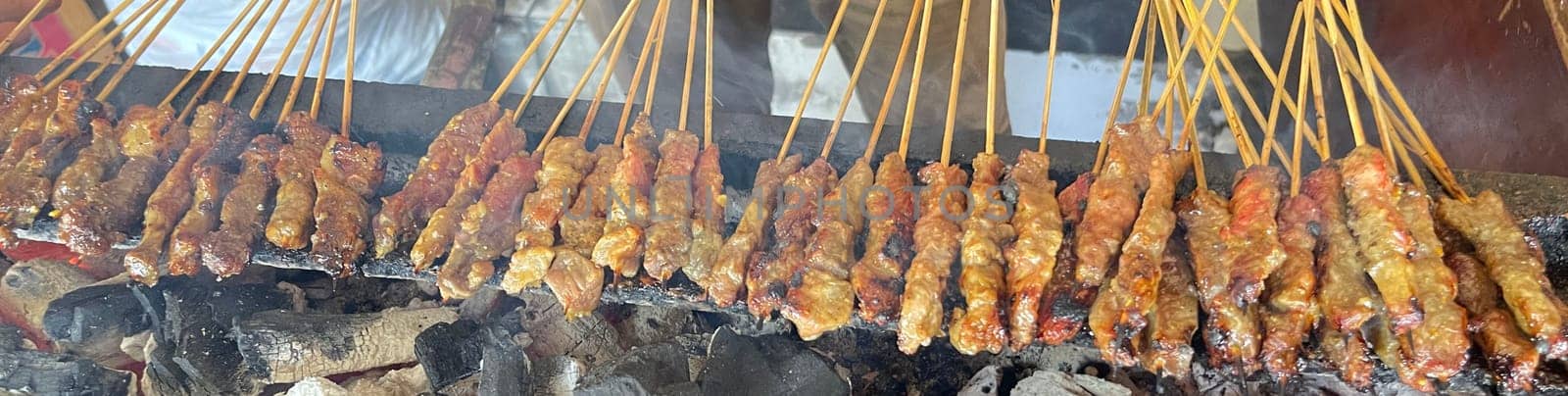 very flavorful beef satay meat grilled over charcoal, beef skewer delicious barbeque, sate sapi