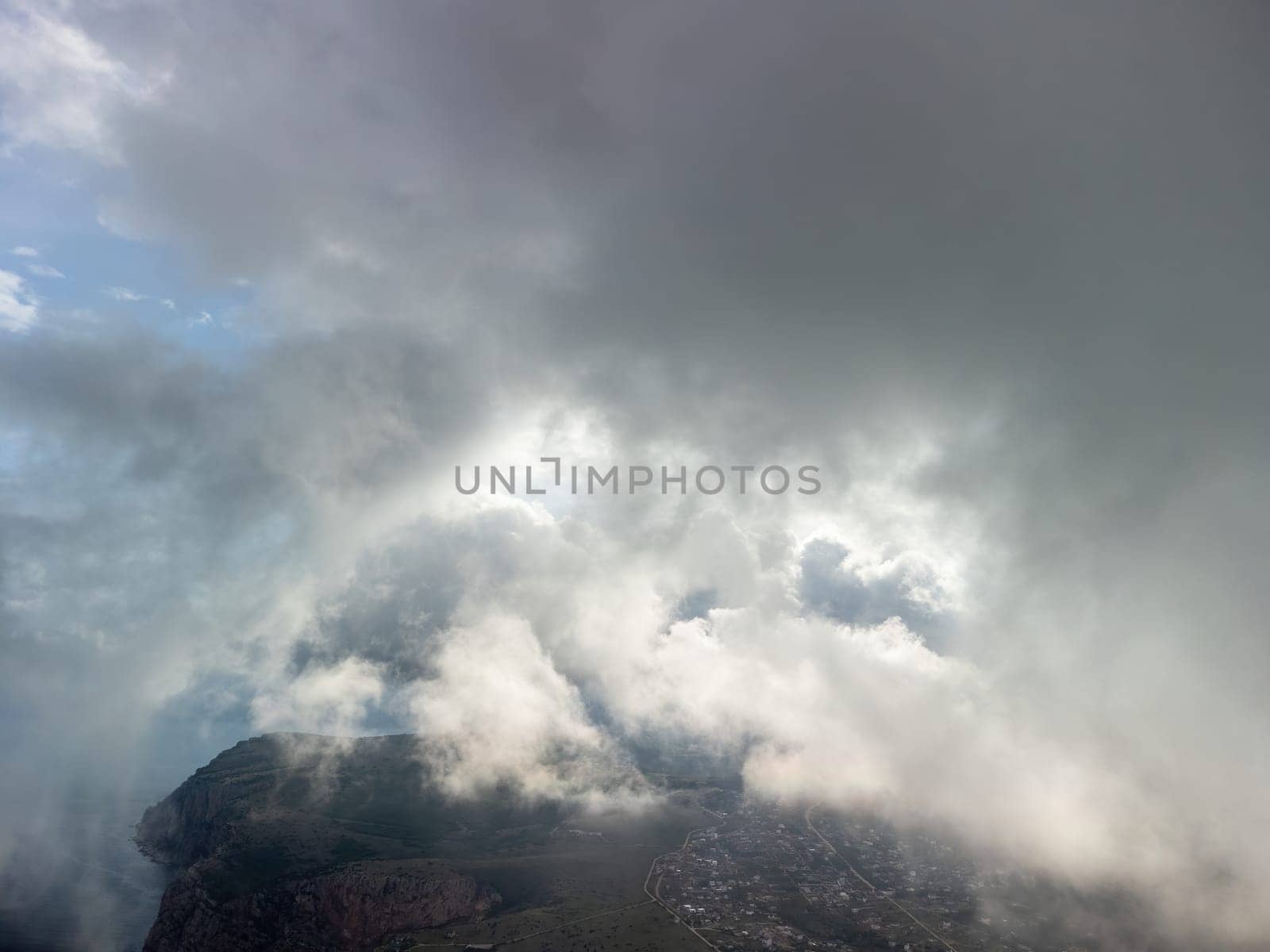 Blue sky with white clouds over calm summer panorama of the sea. Drone aerial view. Abstract aerial nature summer ocean sunset sea and sky background. Horizon. No people. Holiday and vacation concept