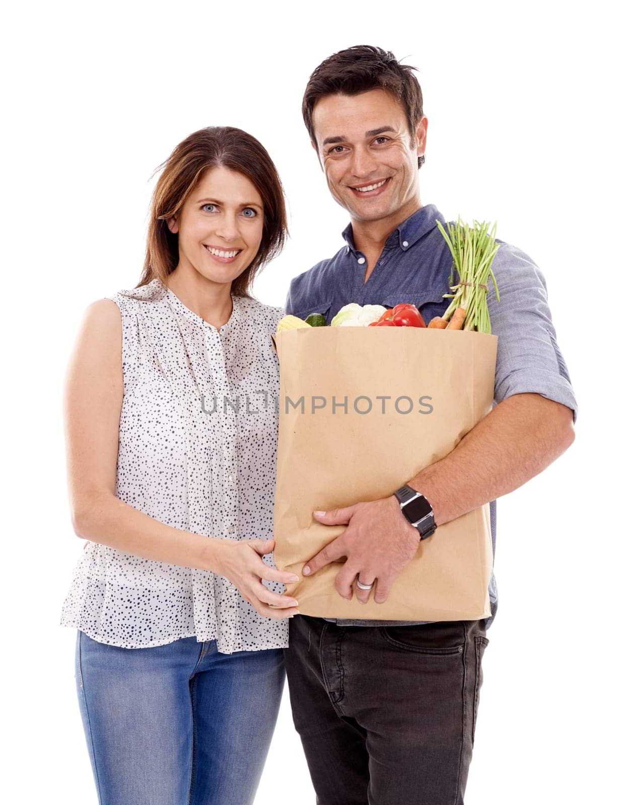 Happy couple, portrait and bag with groceries for food, natural sustainability or fashion on a white studio background. Man and woman with smile for grocery shopping, casual clothing or supermarket by YuriArcurs