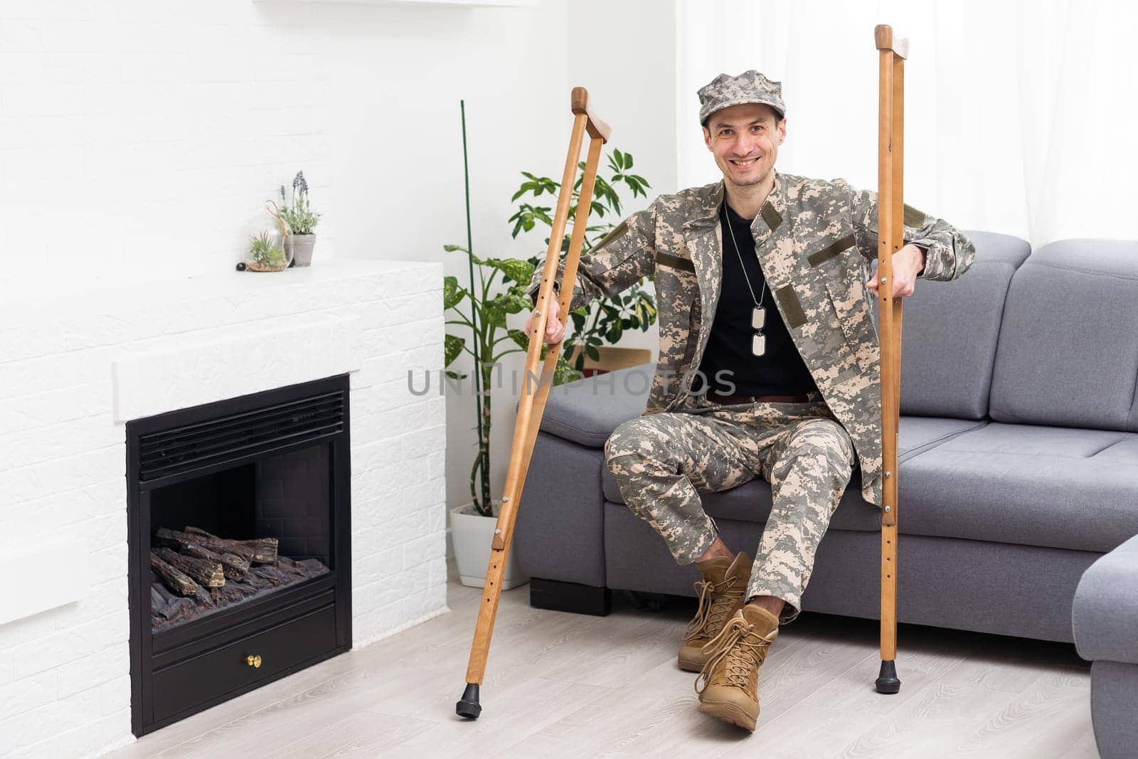 military man with crutches, disability.
