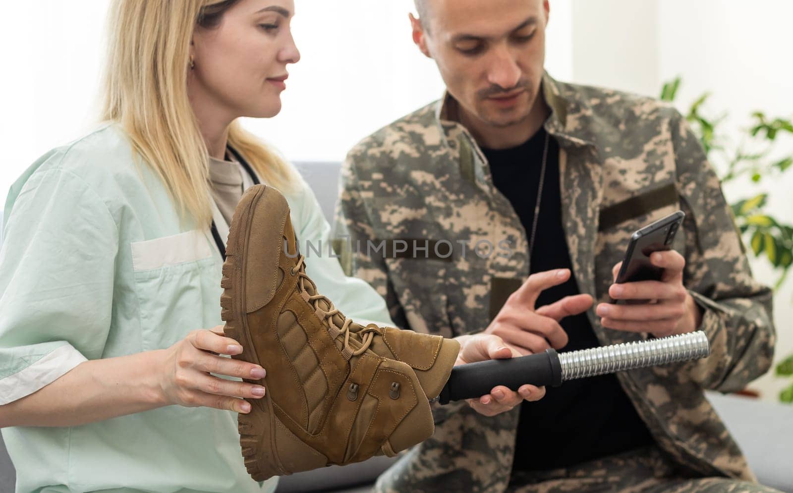 Doctor examines patient's leg in the office. Knee injury concept. High quality photo