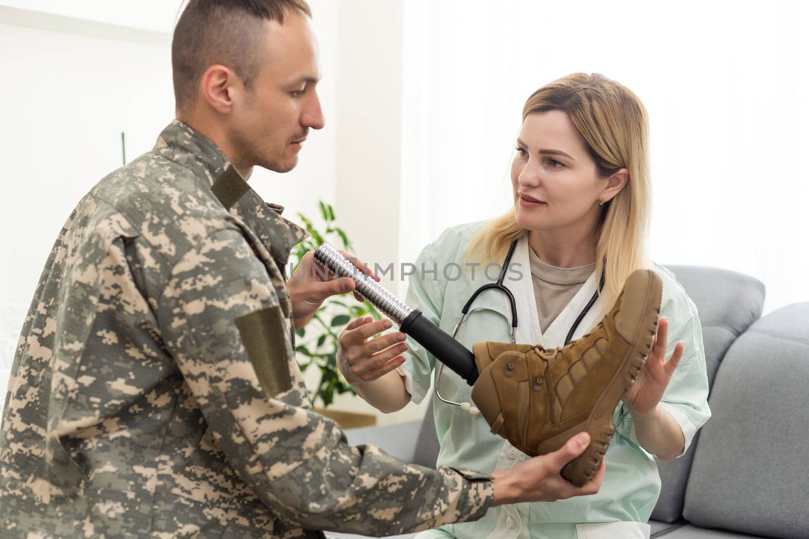 Portrait of a disabled US military officer holding prosthesis leg . High quality photo
