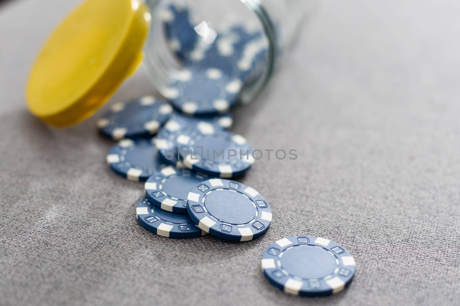 This eye catching image of two miniature businessmen shaking hands could be used for the stock market, banking, real estate and wealth management. The blue chips represent a solid investment. High quality photo