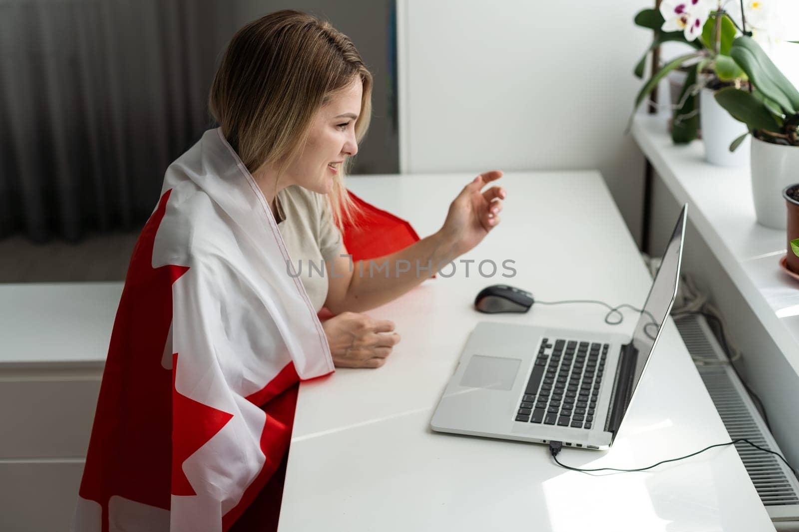 Young female student with Canadian flag and laptop with space for text by Andelov13