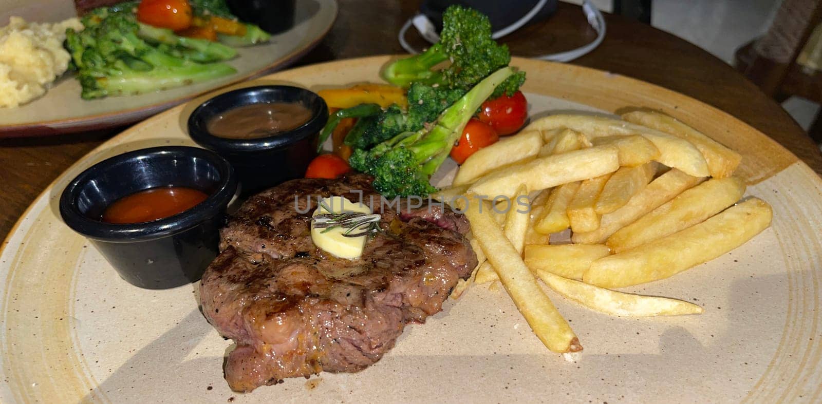 prime sirloin beef steak along with mash potatoes with delicious mushroom sauce and green salad onion new york sirloin