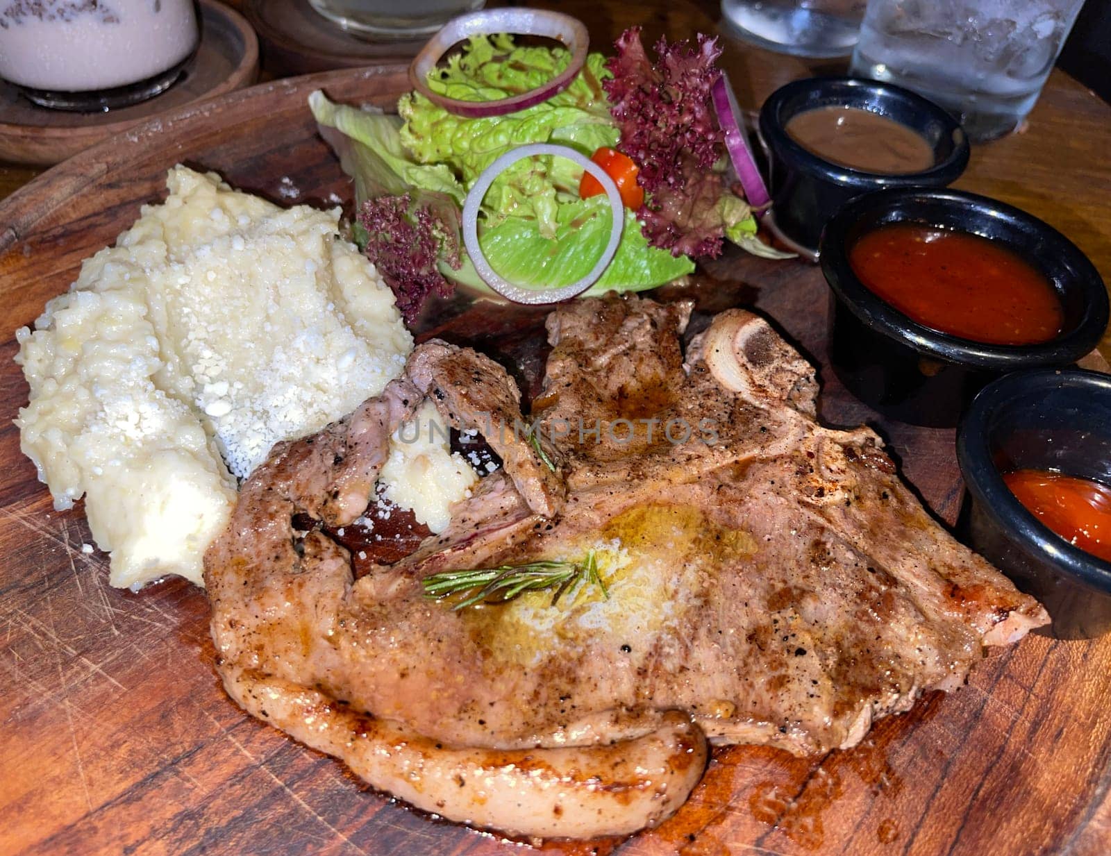 prime sirloin beef steak along with mash potatoes with delicious mushroom sauce and green salad onion new york sirloin