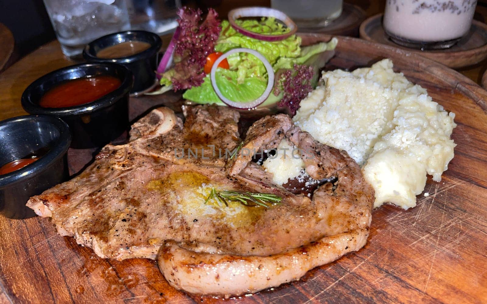 prime sirloin beef steak along with mash potatoes with delicious mushroom sauce and green salad onion new york sirloin
